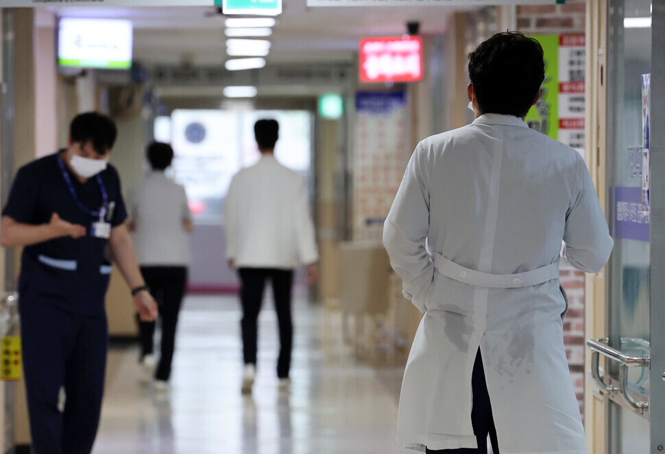 Doctors at Chosun University Hospital in Gwangju’s Dong District walk through the halls of the hospital on March 5, 2024, amid a walkout by residents and interns protesting government plans to raise medical school admission caps. (Yonhap)