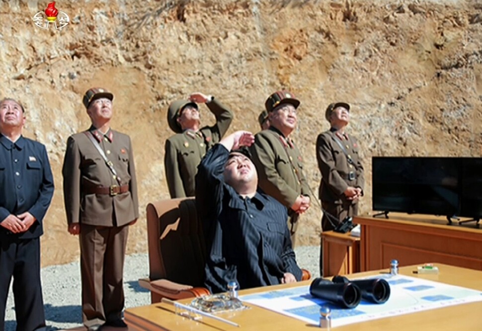 North Korean leader Kim Jong-un observes the launch of a Hwasong-14 intercontinental ballistic missile