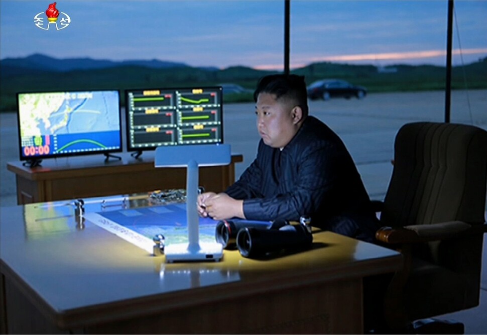 North Korean leader Kim Jong-un oversees preparations for the launch of the Hwasong-12 IRBM on the morning of Aug. 29 in this image from the North Korean Central Television.  (Yonhap News)