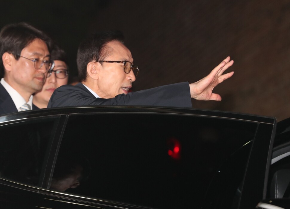 Ex-president Lee Myung-bak is seen leaving his home on Mar. 23