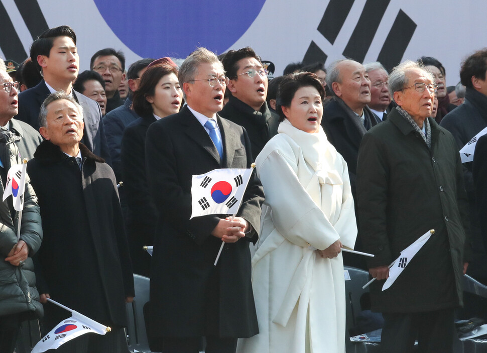 President Moon Jae-in sings the South Korean national anthem alongside his wife