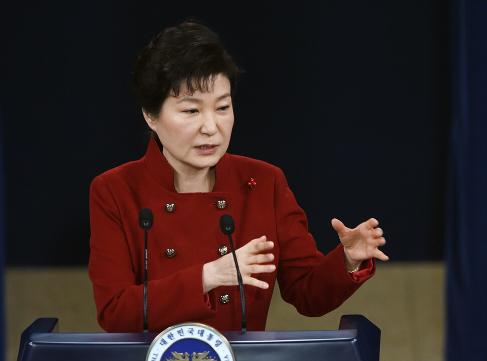 South Korean President Park Geun-hye gestures while responding to a question at a Blue House press conference following her New Year’s address