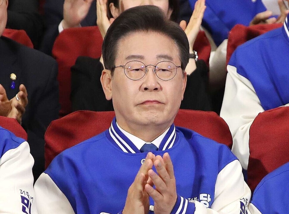 Democratic Party leader Lee Jae-myung applauds as he and other members of party leadership watch exit poll results come in on April 10, 2024, the day of Korea’s general elections. (pool photo)