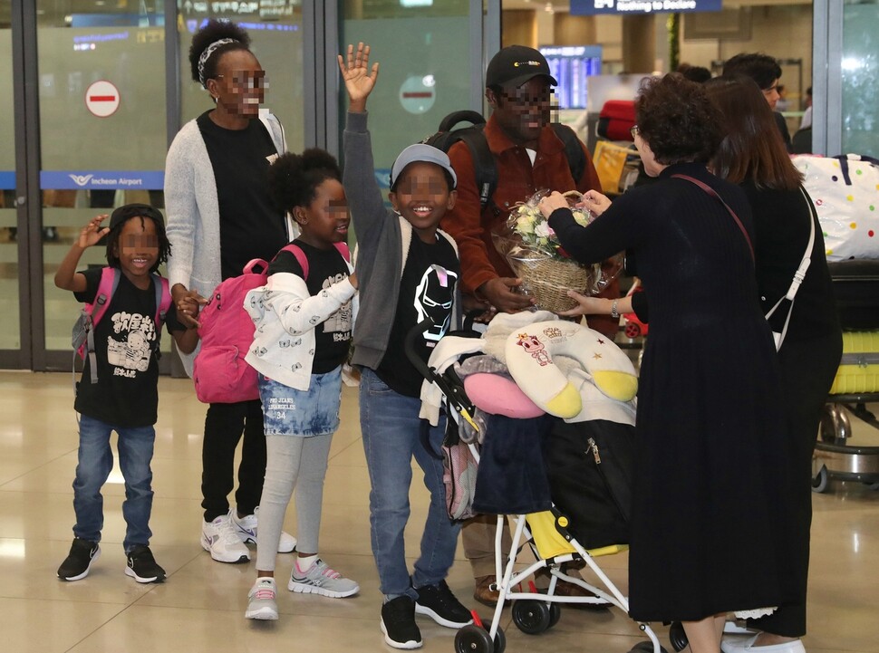 An Angolan family of Congolese descent is permitted to enter South Korea on Oct. 11 after being trapped at Incheon International Airport for 287 days. (Kang Chang-kwang