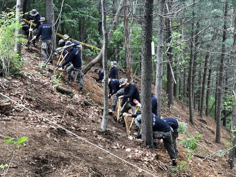 South Korean soldiers work on an exhumation project in July on Bunker Hill in Hongcheon Country
