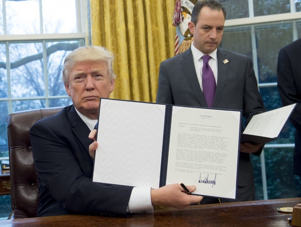 US President Donald Trump after signing an executive order for US departure from the Trans Pacific Partnership