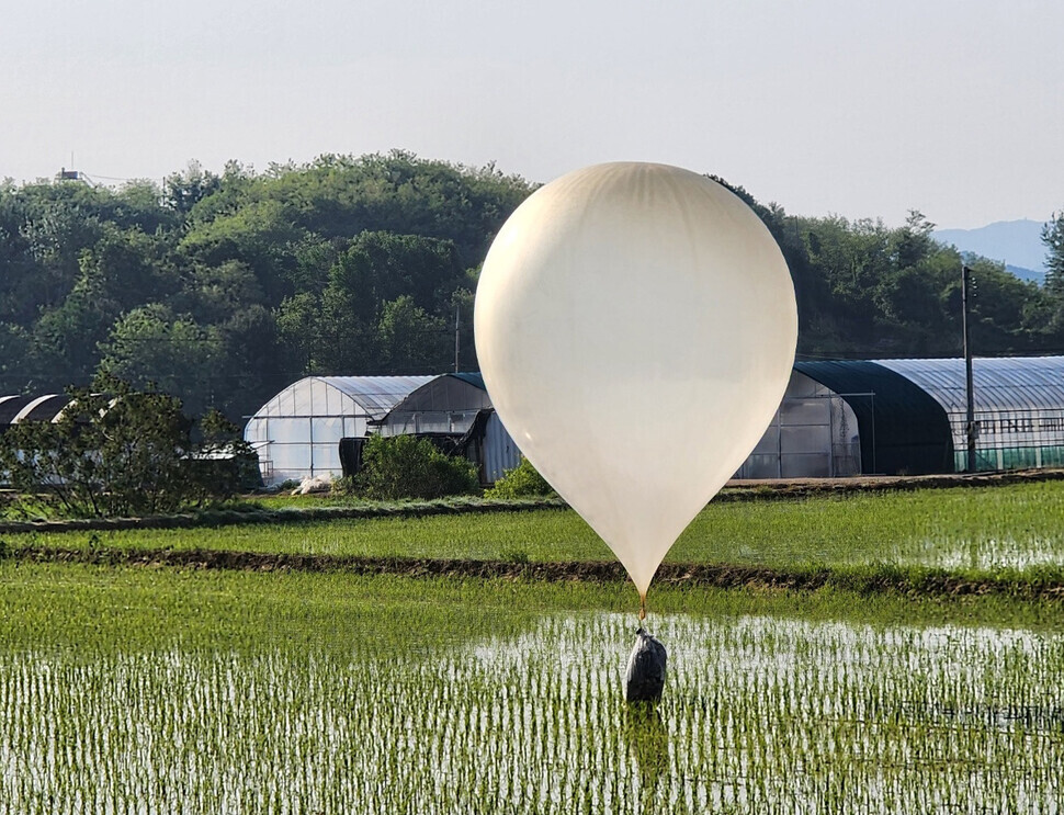 A balloon presumed to have been sent by North Korea lands in a paddy in Cheorwon, near the inter-Korean border, on May 29, 2024. (Yonhap)