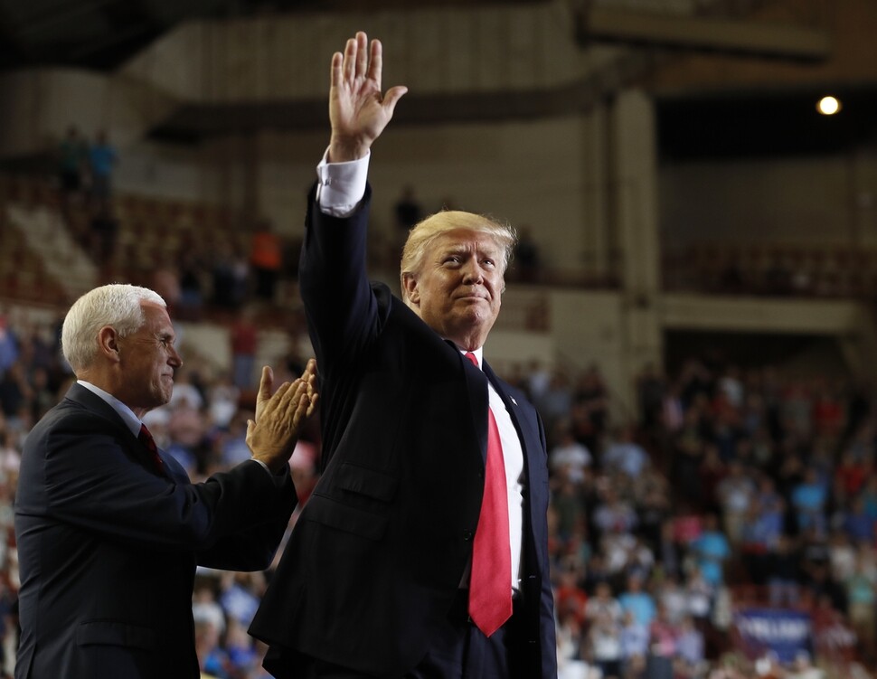 US President Donald Trump waves to supporters at a rally in Harrisburg
