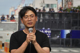 解雇中断を求める「希望のバス」を企画した詩人に懲役2年