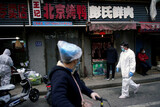 中国、「大恐慌」警告に「失業率２５％」憂慮も